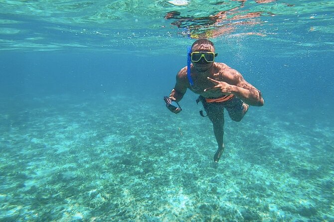 Amazing Catamaran to Isla Mujeres for the best price - Beach club time: calm water, buffet lunch, and a place to actually land
