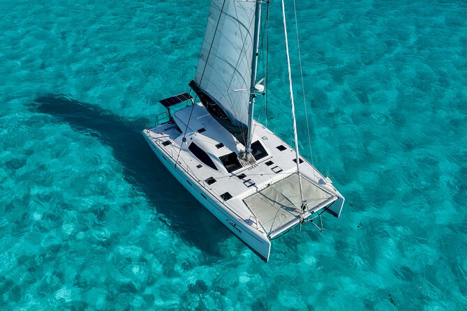Cancún Catamaran to Isla Mujeres + Snorkel, Open Bar & Lunch - On Board: Catamaran Comfort, Drinks, and the Party Volume