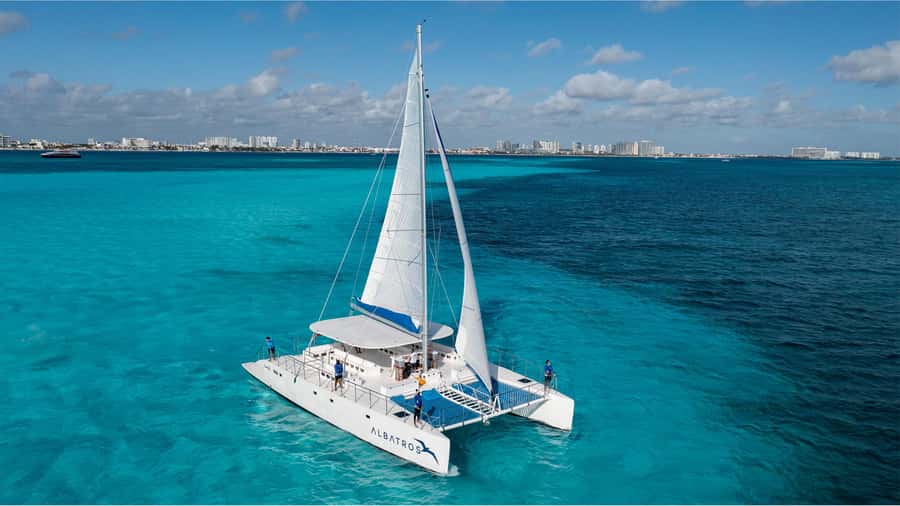 Cancún: Catamaran Tour to Isla Mujeres with Open Bar & Lunch - Catamaran cruise to Isla Mujeres: what the day feels like