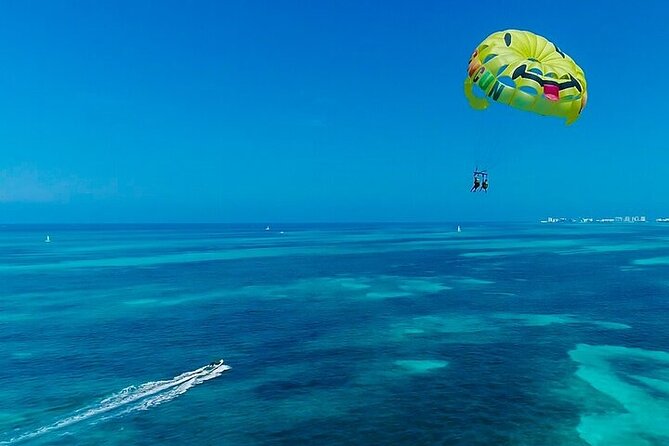 Cancun Combo Adventure: 4 Reef Snorkeling Stops & Parasailing - Four reef snorkeling stops: art, turtles, and a sunken ship