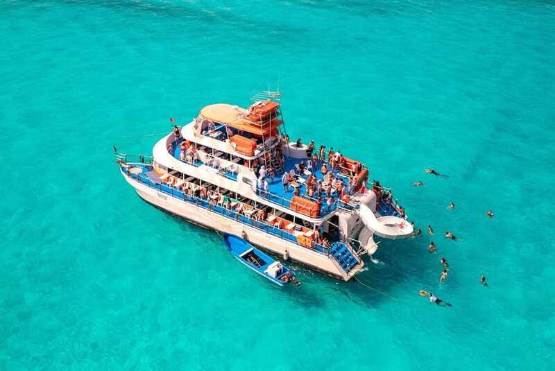 Cancun: Isla Mujeres Full Day Dancer Cruise - Slide, Boards, and In-Water Fun When the Sea Cooperates
