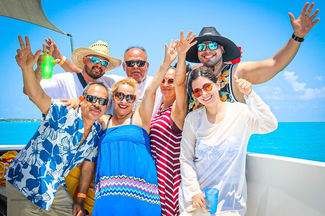 Cancun Private Catamaran to Isla Mujeres with Buffet & Open Bar - Stop by stop: what Playa Tortugas, the El Meco Reef snorkel, and Playa Norte give you