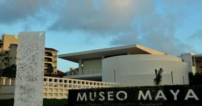 Cancun: Skip-the-Line Mayan Museum & San Miguelito Site - Inside Cancun’s Mayan Museum: tall halls, glass views, and standout art