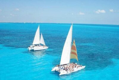 Catamaran Sailing Experience & Snorkeling Tour to Isla Mujeres - Getting on the catamaran: pickup, meeting point, and what to bring