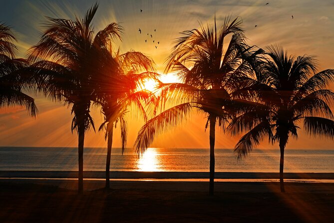 Catamaran to Isla Mujeres at sunset pick up Cancun - Playa Norte and that North Beach swim-from-the-boat feeling