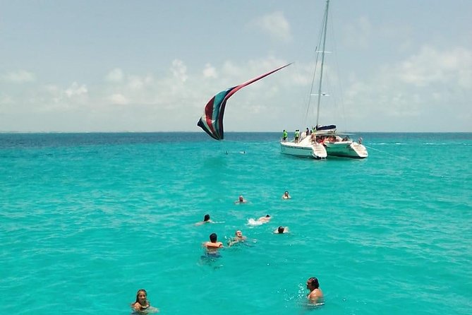 Catamaran to Isla Mujeres, Open bar, buffet, Beach Club Included - Ultramar / Punta Norte walking time: shops and beach access