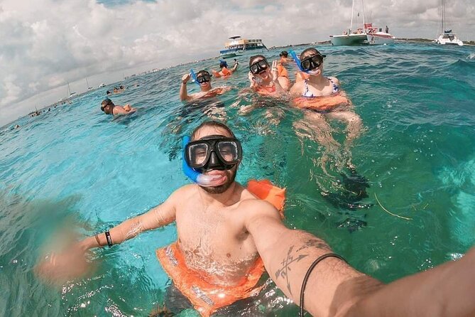 Deluxe Catamaran to Isla Mujeres, with Drinks, Snorkel & Buffet - Beach Club Finale: Mexican Buffet and Time to Unwind