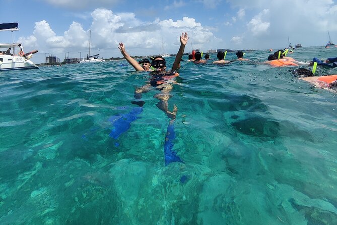 Isla Mujeres Catamaran Tour from Cancun with Snorkel and Open Bar - Snorkeling off Isla Mujeres: colorful fish and a real-world swim check