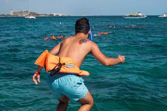 Isla Mujeres Catamaran tour with Open Bar, Lunch and Snorkeling - The short island photo walk: small time, big payoff