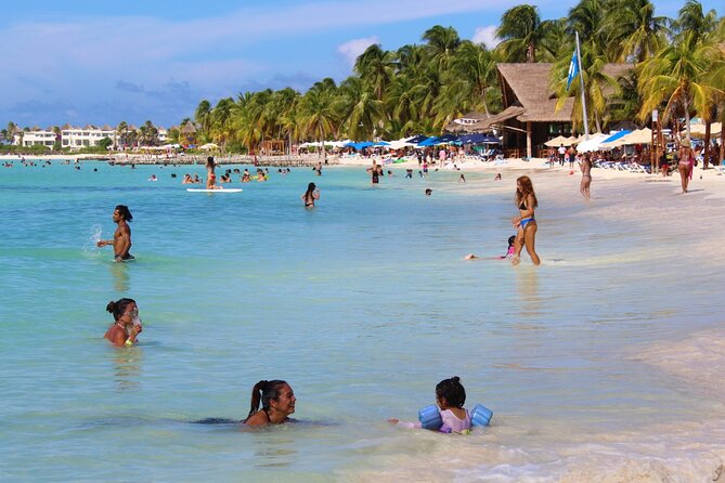 Isla Mujeres Catamaran Tour with Snorkeling at MUSA, Buffet Lunch & Open Bar - Cancun catamaran energy: boarding, music, and the open bar start