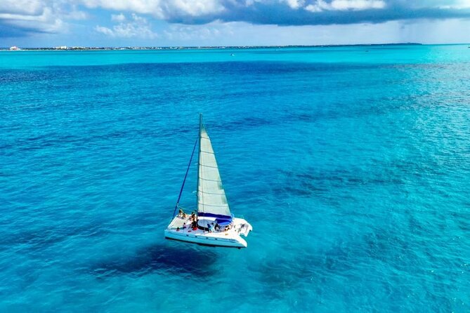 Isla Mujeres: Catamaran Tour with Snorkeling Food, Drinks, Beach - Spinnaker Flight and Weather: The One Included Thing You Can’t Control