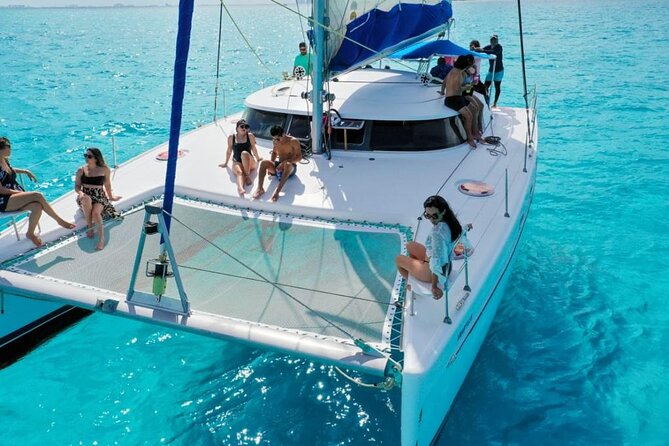Isla Mujeres: Catamaran Tour with Snorkeling Food, Drinks, Beach - Isla Mujeres Center Stop: Crafts, Tequila Shops, and Beach-Adjacent Wandering