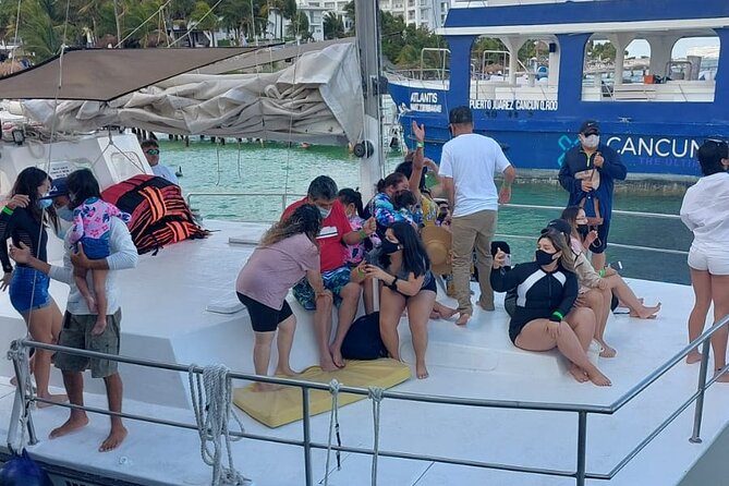 Isla Mujeres Premium Tour in Catamaran with Snorkel and Buffet - Stop 2: Arrecife El Meco snorkeling—fish and underwater sculptures