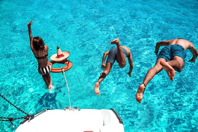 Isla Mujeres Tour on Catamaran with Snorkel, Open Bar, Buffet & Beach club - Isla Mujeres beach club time: buffet and bar, plus the reality of extras