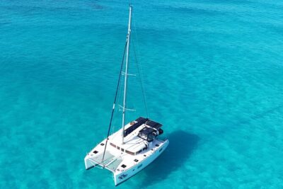Private Catamaran Tour to Isla Mujeres - Cruising out: snacks, soda, and the onboard open bar (age rules included)