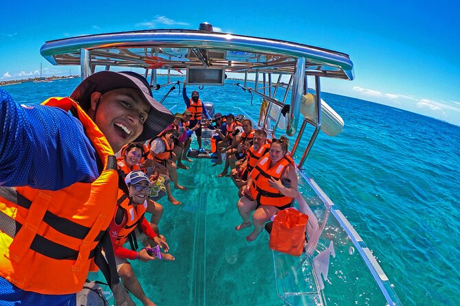 Private Tour Isla Mujeres excursion in Transparent Boat - Boarding at Bartolomé Marina and Heading Toward La Cadenita