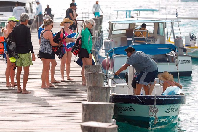Snorkel in the second largest reef in the world Colorful tour in Puerto Morelos - The boat ride to the reef park: calm, direct, and gear-first