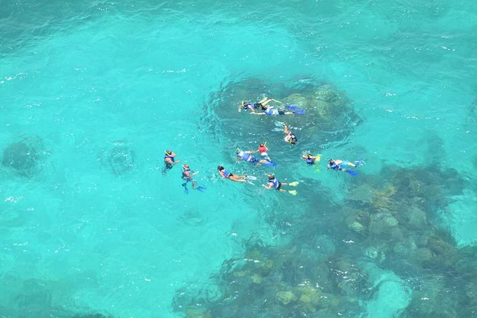 Snorkeling Adventure at Isla Mujeres Includes Lunch and Open Bar - Isla Mujeres free time: folklore streets, quick shopping, and the catch