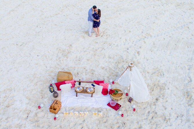 Sunset Beach Proposal - Your candlelit picnic setup: champagne, chocolate strawberries, and a plan