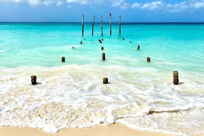 Tour in a Catamaran to Isla Mujeres with all included for the best price! - Isla Mujeres beach club time: lunch, drinks, and a real chunk of sand