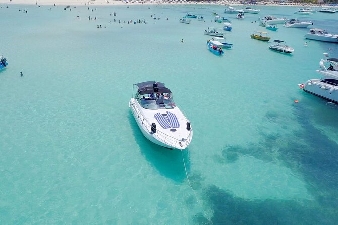 Tour to Isla Mujeres on Premium Yachts from Cancun - Stop 1 in Cancun: bay views and snorkeling at El Meco Reef or a shipwreck